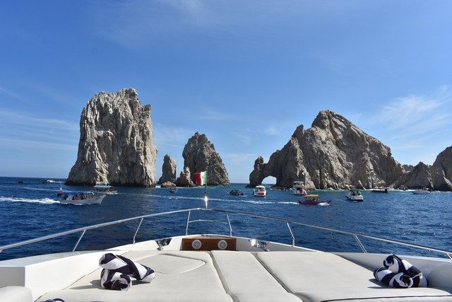 View from the bow of a yacht toward El Arco and the rocks of Land's End